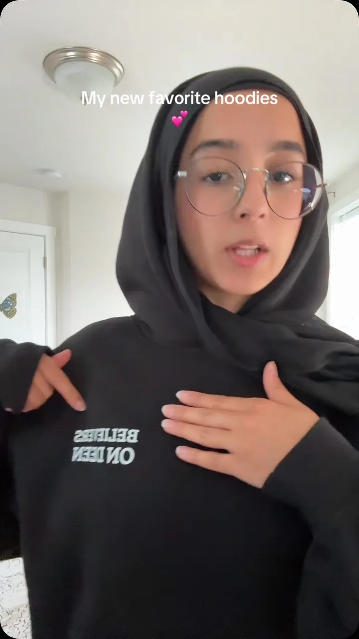 Cover frame from @maryams_png's reel, wearing the United Ummah Hoodie